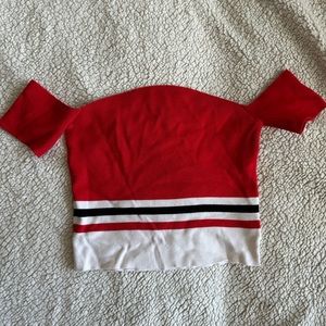 Divided red crop top with off the shoulder sleeves